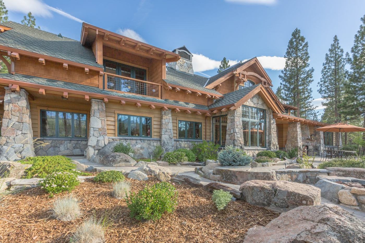 19th Hole Paradise, a long timber and stone estate above a granite garden